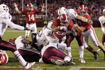 TUSCALOOSA, AL - NOVEMBER 15:  Mark Ingram #22 of the Alabama Crimson Tide leaps for the endzone as he is grabbed by Jasper O'Quinn #23 of the Mississippi State Bulldogs at Bryant-Denny Stadium on November 15, 2008 in Tuscaloosa, Alabama.  (Photo by Kevin