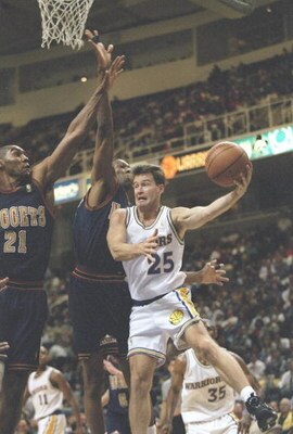 3 Dec 1996: Guard Mark Price of the Golden State Warriors tries to drive past forward Tom Hammonds of the Denver Nuggets at the San Jose Arena in San Jose, California. The Warriors won the game 114-99.