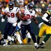 GREEN BAY, WI - DECEMBER 07:  Running back Steve Slaton #20 of the Houston Texans carries the ball while being pursued by Desmond Bishop #55 of the Green Bay Packers during the first half at Lambeau Field on December 7, 2008 in Green Bay, Wisconsin. The T