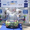 LOUTRAKI, GREECE - JUNE 14:  Mikko Hirvonen of Finland and Jarmo Lehtinen of Finland celebrate victory on the podium after winning the WRC Acropolis Rally of Greece on June 14, 2009 in Loutraki, Greece  (Photo by Massimo Bettiol/Getty Images)