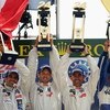LE MANS, FRANCE - JUNE 14:  Peugeot drivers Marc Gene, Alex Wurz and David Brabham celebrate on the podium after winning the Le Mans 24h race on June 14, 2009 in Le Mans, France.  (Photo by Bryn Lennon/Getty Images)