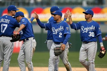 CHICAGO - APRIL 09:  (L-R) Mike Jacobs #17, David DeJesus #9, Coco Crisp #2 and Mike Aviles #30 of the Kansas City Roayls celebrate after their 2-1 win against the Chicago White Sox at U.S. Cellular Field on April 9, 2009 in Chicago, Illinois.  (Photo by 