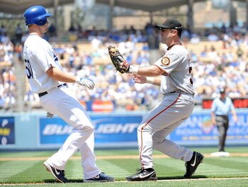 LOS ANGELES, CA - MAY 09:  Rich Aurilia #35 of the San Francisco Giants tags out Eric Stults #50 of the Los Angeles Dodgers during the second inning at Dodger Stadium on May 9, 2009 in Los Angeles, California.  (Photo by Harry How/Getty Images)