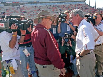 CLEMSON, SC - NOVEMBER 12:  Coach Tommy Bowden of the Clemson Tigers (R) talks with his father, coach Bobby Bowden of the Florida State Seminoles before an Atlantic Coast Conference game on November 12, 2005 at Clemson Memorial Stadium in Clemson, South C