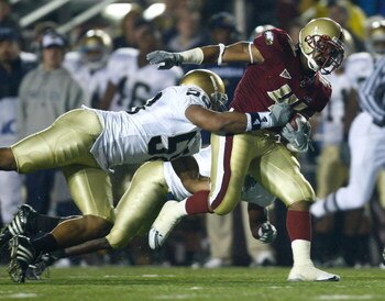 CHESTNUT HILL, MA - NOVEMBER 8: Montel Harris #41 of the Boston College Eagles gain yardage against Brian Smith #58 of the Notre Dame Fighting Irish on November 8, 2008 at Alumni Stadium in Chestnut Hill, Massachusetts.(Photo by Jim Rogash/Getty Images)