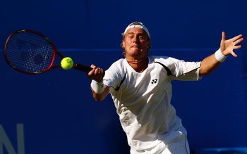 LONDON, ENGLAND - JUNE 11:  Lleyton Hewitt of Australia plays a backhand during the men's third round match against Andy Roddick of USA during Day 3 of the the AEGON Championship at Queens Club on June 11, 2009 in London, England.  (Photo by Ian Walton/Ge
