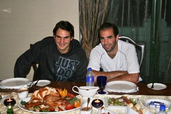 KUALA LUMPUR, MALAYSIA - NOVEMBER 22: In this handout image provided by the ATP tennis star Roger Federer, left, takes time out from the Federer vs. Sampras Asian exhibition tour to host Pete Sampras for a traditional American Thanksgiving on November 22,