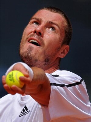 MADRID, SPAIN - MAY 11:  Marat Safin of Russia serves the ball in his first round match against Jo-Wilfried Tsonga of France during the Madrid Open tennis tournament at the Caja Magica on May 11, 2009 in Madrid, Spain. Tsjonga won the match in two sets, 6