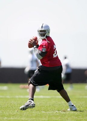 ALAMEDA, CA - MAY 08:  JaMarcus Russell #2 of the Oakland Raiders drops back to pass the ball during the Raiders minicamp at the team's permanent training facility on May 8, 2009 in Alameda, California.  (Photo by Ezra Shaw/Getty Images)