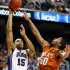 GREENSBORO, NC - MARCH 21:  Gerald Henderson #15 of the Duke Blue Devils shoots over Varez Ward #50 of the Texas Longhorns during the second round of the NCAA Division I Men's Basketball Tournament at the Greensboro Coliseum on March 21, 2009 in Greensbor