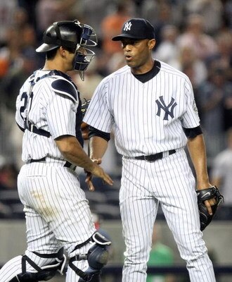 NEW YORK - JUNE 08:  Mariano Rivera #42 of the New York Yankees celebrates the save with catcher Jorge Posada #20 against the Tampa Bay Rays on June 8, 2009 at Yankee Stadium in the Bronx borough of New York City.  (Photo by Nick Laham/Getty Images)