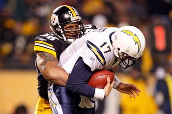 PITTSBURGH - JANUARY 11:  LaMarr Woodley #56 of the Pittsburgh Steelers sacks Philip Rivers #17 of the San Diego Chargers in the fourth quarter during their AFC Divisional Playoff Game on January 11, 2009 at Heinz Field in Pittsburgh, Pennsylvania. Steele