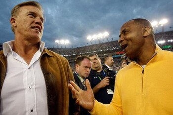 TAMPA, FL - FEBRUARY 01:  (L-R) Hall of famers John Elway and Lynn Swann on the field prior to Super Bowl XLIII between the Arizona Cardinals and the Pittsburgh Steelers on February 1, 2009 at Raymond James Stadium in Tampa, Florida.  (Photo by Jamie Squi