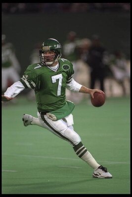 3 Dec 1995:  Quarterback Boomer Esiason #7 of the New York Jets scrambles out of the pocket and looks downfield for an open receiver during the game against the St. Louis Rams at The Meadowlands in East Rutherford, New Jersey.  The Rams defeated the Jets