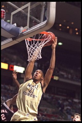 29 Nov 1995:  Center Tim Duncan #21 of the Wake Forest Demon Deacons slams the ball at The Palace of Auburn Hills, Michigan, during the game against the Oklahoma State Cowboys at the Great eight tournament.  Wake Forest advanced to the Final Four.  Mandat