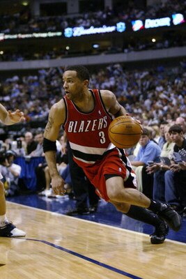 DALLAS - MAY 4:  Damon Stoudamire #3 of the Portland Trail Blazers drives in Game seven of the Western Conference Quarterfinals against the Dallas Mavericks during the 2003 NBA Playoffs at American Airlines Center on May 5, 2003 in Dallas, Texas.  The Mav
