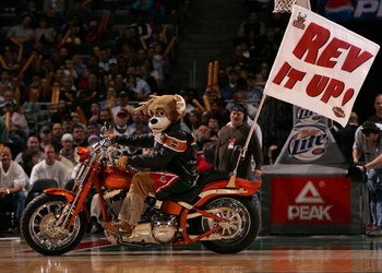 MILWAUKEE - MARCH 07: Bango, the mascot of the Milwaukee Bucks, rides a motorcycle during a break in the action between the Bucks and the Portland Trail Blazers on March 7, 2008 at the Bradley Center in Milwaukee, Wisconsin. The Trail Blazers defeated the