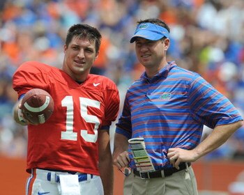GAINESVILLE, FL - APRIL 18: Quarterback Tim Tebow #15 of the University of Florida talks with quarterbacks coach Scott Loeffler  during the spring football Orange and Blue game April 18, 2009 at Ben Hill Griffin Stadium in Gainesville, Florida.  (Photo by