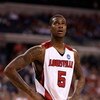 INDIANAPOLIS - MARCH 27:  Earl Clark #5 of the Louisville Cardinals looks on against the Arizona Wildcats during the third round of the NCAA Division I Men's Basketball Tournament at the Lucas Oil Stadium on March 27, 2009 in Indianapolis, Indiana.  (Phot