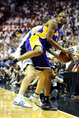 ORLANDO, FL - JUNE 14:  Trevor Ariza #3 of the Los Angeles Lakers attempts to save the ball in front of Hedo Turkoglu #15 of the Orlando Magic in the second quarter of Game Five of the 2009 NBA Finals on June 14, 2009 at Amway Arena in Orlando, Florida.  