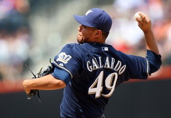 NEW YORK - APRIL 18:  Yovani Gallardo #49 of the Milwaukee Brewers deals a pitch against the New York Mets on April 18, 2009 at Citi Field in the Flushing neighborhood of the Queens borough of New York City.  (Photo by Jim McIsaac/Getty Images)