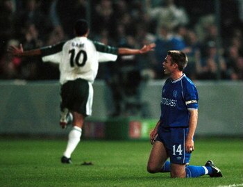 28 Sep 2000:  Ionel Gane of St Gallen celebrates as a dejected Captain Greama Le Saux of Chelsea during the UEFA Cup First leg second round match between St Gallen and Chelsea played at the Hardturm Stadium in Zurich. Mandatory Credit: Graham Chadwick/ALL