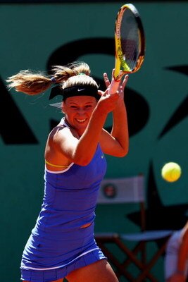 PARIS - MAY 30:  Victoria Azarenka of Belarus hits a forehand during her Women's Singles Third Round match against Carla Suarez Navarro of Spain on day seven of the French Open at Roland Garros on May 30, 2009 in Paris, France.  (Photo by Clive Brunskill/
