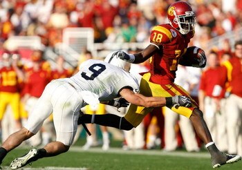 PASADENA, CA - JANUARY 01:  Damian Williams #18 of the USC Trojans runs for yardage past Mark Rubin #9 of the Penn State Nittany Lions during the 95th Rose Bowl Game presented by Citi on January 1, 2009 at the Rose Bowl in Pasadena, California.  (Photo by