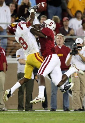 STANFORD, CA - NOVEMBER 15:  Wopamo Osaisai #6 of the Stanford Cardinals breaks up a pass to Ronald Johnson #8 of USC Trojans at Stanford Stadium on November 15, 2008 in Stanford, California.  (Photo by Jed Jacobsohn/Getty Images)