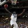 GLENDALE, AZ - MARCH 26:  Guard Tyreke Evans #12 of the Memphis Tigers goes to dunk the ball against the Missouri Tigers in the Sweet 16 of the NCAA Division I Men's Basketball Tournament at the University of Phoenix Stadium on March 26, 2009 in Glendale,