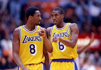 31 Oct 1997:  Guards Kobe Bryant (left) and Eddie Jones of the Los Angeles Lakers talk during a game against the Utah Jazz at the Great Western Forum in Inglewood, California.  The Lakers won the game 104-87. Mandatory Credit: Aubrey Washington  /Allsport