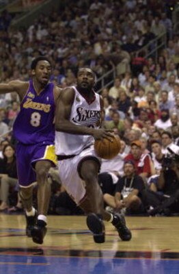 15 Jun 2001:  Aaron McKie #8 of the Philadelphia 76ers drives to the basket against the defense of Kobe Bryant #8 of the Los Angeles Lakers in game five of the NBA Finals at the First Union Center in Philadelphia, Pennsylvania.  The Lakers won 108-86 to t