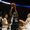 MIAMI - MARCH 20:  Guard Dionte Christmas #22 (C)  of the Temple Owl  drives to the basket past  forward Jeff Pendergraph #3  (L) and forward Rihards Kuksiks #30 (R) of the Arizona State Sun Devils during the first round of the NCAA Division I Men's Baske