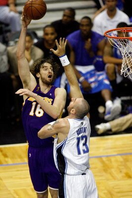 ORLANDO, FL - JUNE 14:  Pau Gasol #16 of the Los Angeles Lakers shoots over Marcin Gortat #13 of the Orlando Magic in the second half of Game Five of the 2009 NBA Finals on June 14, 2009 at Amway Arena in Orlando, Florida.  NOTE TO USER:  User expressly a