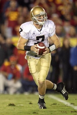 LOS ANGELES - NOVEMBER 29:  Quarterback Jimmy Clausen #7 of the Notre Dame Fighting Irish moves back to pass the ball during the game against the USC Trojans at the Memorial Coliseum on November 29, 2008 in Los Angeles, California. (Photo by: Jeff Gross/G