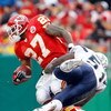 KANSAS CITY, MO - DECEMBER 14:  Larry Johnson #27 of the Kansas City Chiefs is tackled by Tim Dobbins #51 of the San Diego Chargers during the first half on December 14, 2008 at Arrowhead Stadium in Kansas City, Missouri. The Chiefs lost 22-21.  (Photo by