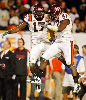 MIAMI - JANUARY 01: Kam Chancellor #17 of the Virginia Tech Hokies celebrates after making an interception with teammate Nekos Brown #47 against  the Cincinnati Bearcats the FedEx Orange Bowl at Dolphin Stadium on January 1, 2009 in Miami, Florida.  (Phot