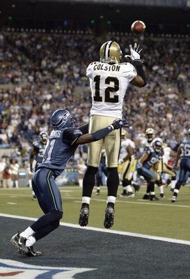SEATTLE - OCTOBER 14: Marques Colston #12of the New Orleans Saints leaps to make the reception Kelly Jennings #21of  the Seattle Seahawks at Qwest Field on October 14, 2007 in Seattle, Washington. The Saints defeated the Seahawks 28-17. (Photo by Otto Gre