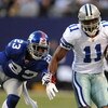 EAST RUTHERFORD, NJ - NOVEMBER 02:  Roy Williams #11 of the Dallas Cowboys catches a pass as Corey Webster #23 of the New York Giants defends during their game on November 2, 2008 at Giants Stadium in East Rutherford, New Jersey.  (Photo by Al Bello/Getty