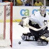 UNIONDALE, NY - APRIL 15:  Sebastien Caron #31 of the Pittsburgh Penguins watches the puck after making a save against the New York Islanders on April 15, 2006 at the Nassau Coliseum in Uniondale, New York. The Isles defeated the Pens 5-4 after a shootout