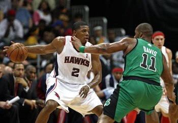 ATLANTA - APRIL 26: Guard Joe Johnson #2 of the Atlanta Hawks dribbles around forward Glen Davis #11 of the Boston Celtics during Game Three of the Eastern Conference Quarterfinals against the Atlanta Hawks during the 2008 NBA Playoffs at the Philips Aren