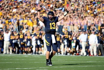 BERKELEY, CA - NOVEMBER 22:  Kevin Riley #13 of the California Golden Bears signals for a touchdown against the Stanford Cardinal during an NCAA football game on November 22, 2008 at Memorial Stadium in Berkeley, California.  (Photo by Jed Jacobsohn/Getty