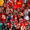 KANSAS CITY, MO - SEPTEMBER 28:  Fans cheer as teammates congratulate Larry Johnson #27 of the Kansas City Chiefs after Johnson rushed for a touchdown during the fourth quarter of the game against the Denver Broncos on September 28, 2008 at Arrowhead Stad