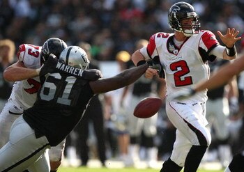 OAKLAND, CA - NOVEMBER 02: Matt Ryan #2 of the Atlanta Falcons fumbles the ball as Gerard Warren #61 of the Oakland Raiders defends during an NFL game on November 2, 2008 at the Oakland-Alameda County Coliseum in Oakland, California.  (Photo by Jed Jacobs