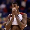 INDIANAPOLIS - MARCH 29:  Earl Clark #5 of the Louisville Cardinals covers his face with his jersey in the final minute of their 64-52 loss against the Michigan State Spartans during the fourth round of the NCAA Division I Men's Basketball Tournament at t