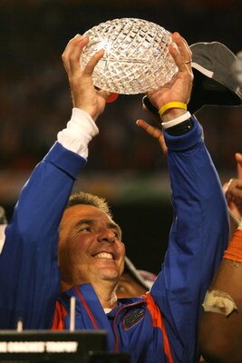 MIAMI - JANUARY 08:  Head coach Urban Meyer of the Florida Gators celebrates with the National Championship trophy after their 24-14 win against the Oklahoma Sooners during the FedEx BCS National Championship game at Dolphin Stadium on January 8, 2009 in 