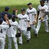 MILWAUKEE - MAY 14: Mike Cameron #25, Chris Duffy #16, Ryan Braun #6 and Rickie Weeks #23 of the Milwaukee Brewers celebrate a win over the Florida Marlins with teammates on May 14, 2009 at Miller Park in Milwaukee, Wisconsin. The Brewers defeated the Mar