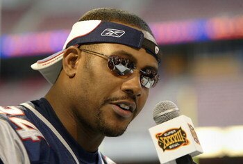 HOUSTON - JANUARY 27:  Cornerback Ty Law #24 of the New England Patriots answers questions on media day January 27, 2003 at Reliant Stadium before Super Bowl XXXVIII against the Carolina Panthers in Houston, Texas.  (Photo by Brian Bahr/Getty Images)