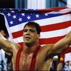 31 Jul 1996: Kurt Angle of the United States holds the American flag at the free-style wrestling competition during the Summer Olympics at the Georgia World Congress Center in Atlanta, Georgia.