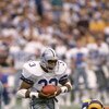 ANAHEIM, CA - JANUARY 4:  Running back Tony Dorsett #33 of the Dallas Cowboys rushes for yards during a 1985 NFC Divisional Playoff game against the Los Angeles Rams at Anaheim Stadium on January 4, 1996 in Anaheim, California.  The Rams won 20-0.  (Photo